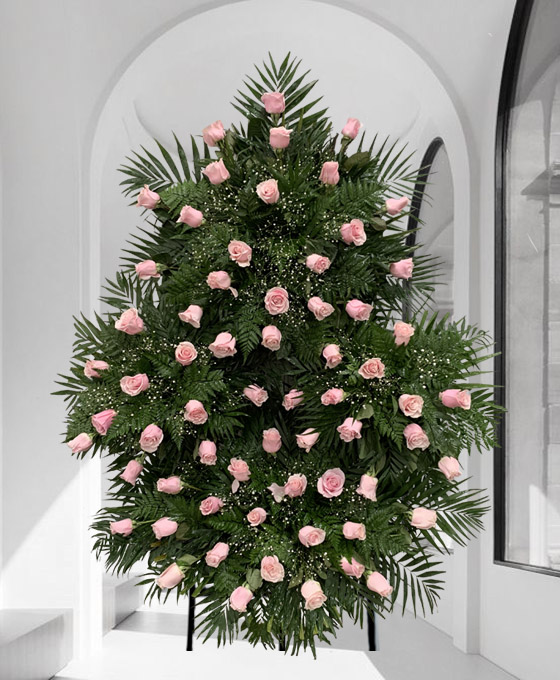 Corona funeraria de rosas rosadas